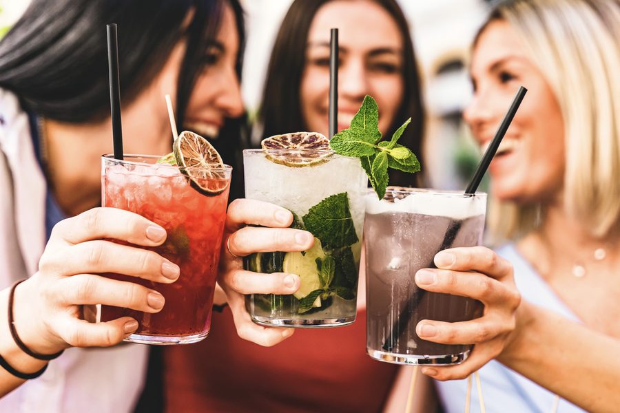 Guests toasting with cocktails at a festive celebration